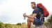 man resting while hiking