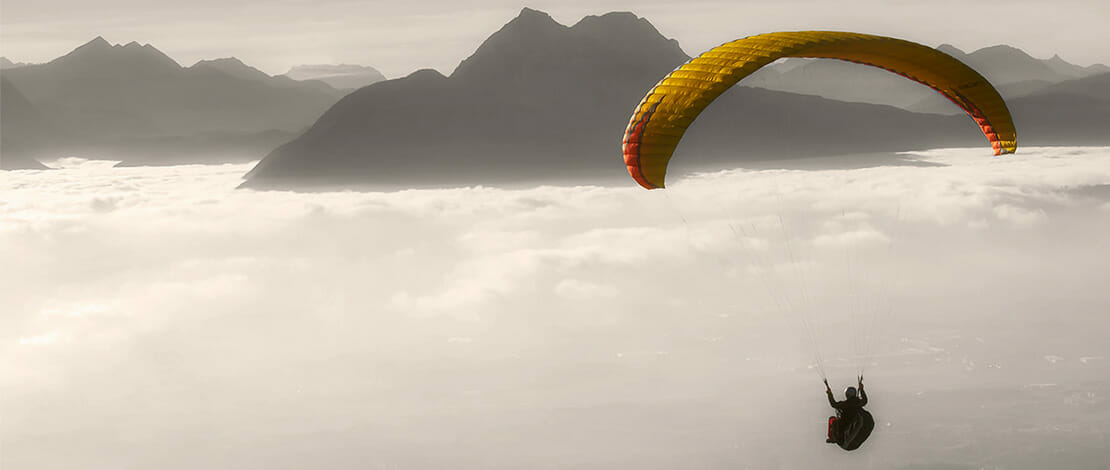 man paragliding