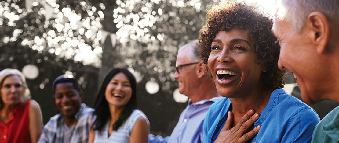 Group of people talking and laughing